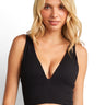 SaltTree ANWND black ribbed seamless V-neck crop top with wide straps worn by a blonde model