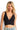 SaltTree ANWND black ribbed seamless V-neck crop top with wide straps worn by a blonde model