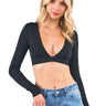 SaltTree ANWND black ribbed long sleeve top with a deep V-neckline worn by a blonde model with blue jeans