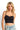 SaltTree ANWND black seamless bustier crop top worn by a blonde model with a sweetheart neckline and thin straps