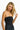 SaltTree model wearing a black ANWND strapless seamless tube top bodysuit with a smooth body-hugging fit.