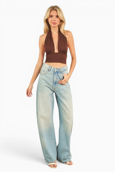 SaltTree ANWND brown halter crop top with deep V-neck, shirred bust, and ribbed waistband worn with light wash jeans