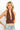 SaltTree ANWND brown halter neck crop top with deep V-neck, shirred bust, and ribbed wide waistband on a model