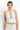 SaltTree ANWND white halter crop top with deep V-neck, shirred bust, and ribbed wide waistband on a model