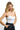SaltTree ANWND white seamless bustier crop top worn by a smiling blonde model against a white background.