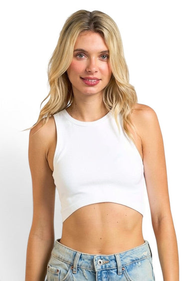 Model wearing a white SaltTree ANWND high neck seamless sleeveless crop top with a fitted ribbed knit design