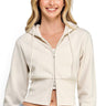 Model wearing a beige SaltTree fleece cropped zip-up hoodie with a two-way zipper and drawstring hood