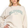 SaltTree model wearing a beige oversized fleece sweatshirt with California Republic embroidery and crew neckline