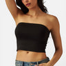 SaltTree model wearing a black Love Poem double-layered strapless tube top in a fitted contour fabric.