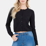 SaltTree model wearing a black slim-fit cropped button-up cardigan with long sleeves and high-waisted blue jeans.