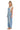 SaltTree model wearing Cello Jeans light wash denim barrel leg overalls with a square neck and racerback straps