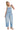 SaltTree model wearing Cello Jeans light wash barrel leg denim overalls with a square neck and racerback straps.