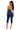 SaltTree DIOSA dark wash denim corset capri jumpsuit with crossback straps and back zipper, worn by a model.