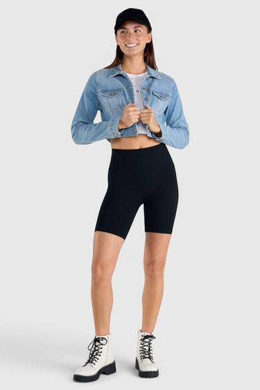 SaltTree model wearing an Enjean stone wash cropped denim jacket with chest pockets and a button-front closure.