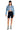 SaltTree model wearing an Enjean stone wash cropped denim jacket with a white crop top and black biker shorts