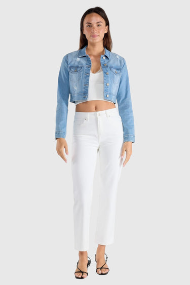 SaltTree Enjean cropped denim jacket in light stone wash with destructed details worn by a model with white pants