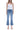 SaltTree model wearing Flying Monkey high rise medium wash kick flare jeans with a distinctive trouser slit hem.