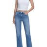 Model wearing SaltTree Flying Monkey super high rise ankle straight jeans in medium dark wash with distressed back hem