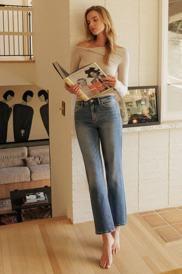 SaltTree model wearing Flying Monkey medium dark wash super high rise ankle straight jeans with distressed back hem