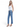 Model wearing SaltTree Flying Monkey high rise ankle straight jeans in medium blue wash with distressed back hem