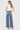 SaltTree model wearing Flying Monkey medium wash high rise wide leg jeans with a half yoke back and trouser hem.