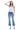 Model wearing SaltTree Flying Monkey high rise kick flare jeans in medium wash with a trouser slit hem