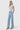 SaltTree model wearing Flying Monkey high rise light wash wide leg jeans with cut seam detail and a 31 inch inseam.