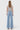 SaltTree Flying Monkey high rise light wash wide leg jeans with cut seam detail viewed from the back on a model.