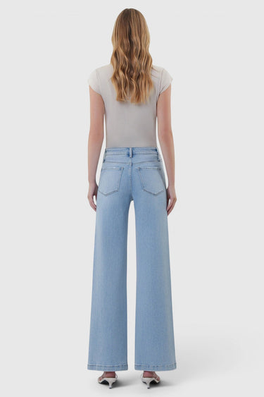 SaltTree Flying Monkey high rise light wash wide leg jeans with cut seam detail viewed from the back on a model.