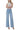 SaltTree model wearing Flying Monkey light wash high rise wide leg jeans with front cut seam detail and 31 inch inseam