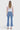 SaltTree Flying Monkey high rise kick flare jeans in medium wash with trouser slit hem, back view on a model.