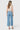 Back view of a model wearing SaltTree Flying Monkey medium wash high rise wide leg cropped jeans with a drawstring
