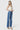 SaltTree Flying Monkey high rise wide leg jeans in medium wash with trouser crease detail on a model in heels
