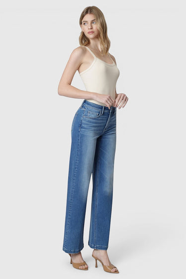 SaltTree Flying Monkey high rise wide leg jeans in medium wash with trouser crease detail on a model in heels