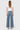 SaltTree Flying Monkey medium wash high rise wide leg jeans with half yoke back detail on a model from behind.