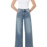 Model wearing SaltTree Flying Monkey medium wash super high rise wide leg jeans with a trouser hem and 2-button waist.