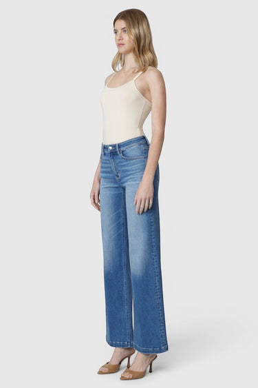 SaltTree model wearing Flying Monkey high rise wide leg jeans in medium wash with a trouser crease and 32 inch inseam