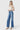 SaltTree model wearing Flying Monkey high rise wide leg trouser jeans in medium wash with a front crease.