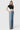 SaltTree model wearing Flying Monkey mid rise wide leg trouser jeans in a light wash with a 32 inch inseam.