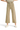 SaltTree Miou Muse high-rise wide-leg cropped pants in tan stretch twill with a raw hem, worn with white sneakers.