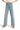 SaltTree Miou Muse high-rise wide-leg cropped pants in light blue stretch twill with a raw hem on a model.