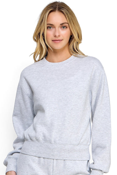 SaltTree model wearing a relaxed fit ice grey fleece sweatshirt with a crew neckline and ribbed trims