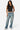 SaltTree Love Poem black sleeveless boatneck jersey top worn by a model with blue jeans and white sneakers