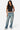 SaltTree Love Poem black sleeveless boatneck jersey top worn by a model with blue jeans and white sneakers