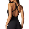SaltTree Love Poem black airbrush onesie romper with crisscross back straps and French-cut leg on a model