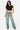Model wearing a black SaltTree Love Poem cropped crew neck tee in smoothing double-layer fabric with blue jeans
