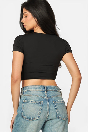 SaltTree Love Poem black cropped crew neck t-shirt with double-layer contour fabric worn by a model from the back.