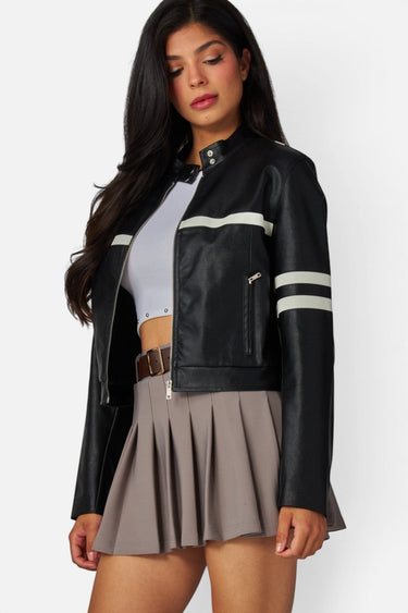 SaltTree Love Poem black faux leather cropped moto jacket with white racing stripes and a high snap collar on a model