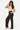 SaltTree Love Poem black ribbed wide-leg pants with drawstring waist and pockets worn by a model in a studio