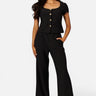 SaltTree Love Poem black scuba knit wide leg pants with belted waist worn by a model with a matching buttoned top